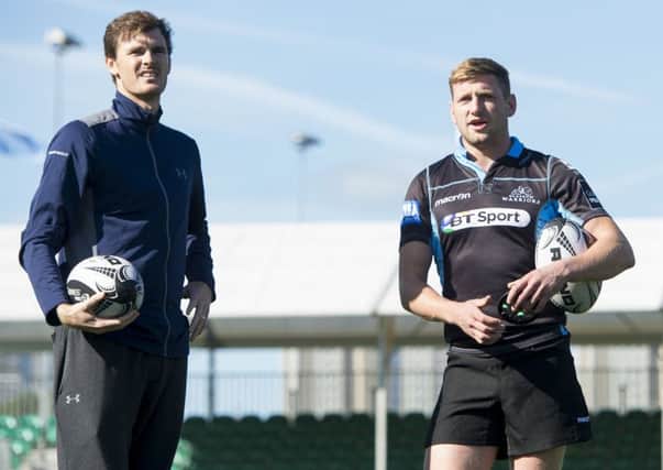 Jamie Murray, left, visited Warriors' training at Scotstoun and is pictured with Glasgow's Finn Russell. Picture: Paul Devlin/SNS Group