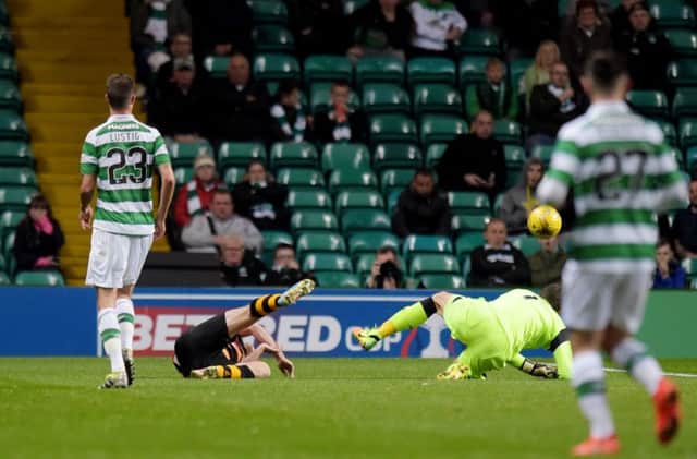 Celtic goalkeeper Craig Gordon with a challenge on Alloa's Greig Spence. Picture: SNS