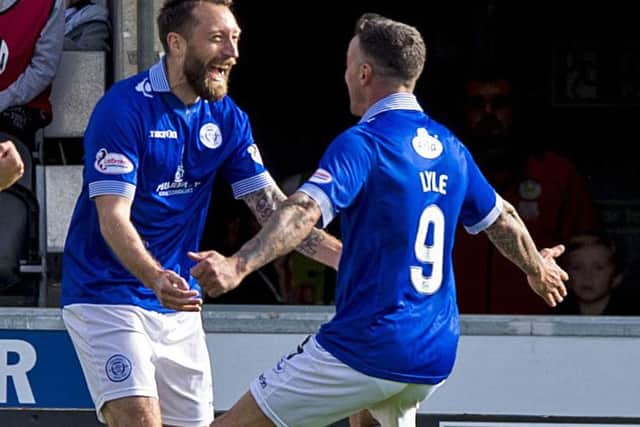 Queen of the South's Stephen Dobbie (left) celebrates agoal with Derek Lyle. Picture: Sammy Turner/SNS