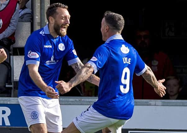 Queen of the South's Stephen Dobbie (left) celebrates agoal with Derek Lyle. Picture: Sammy Turner/SNS