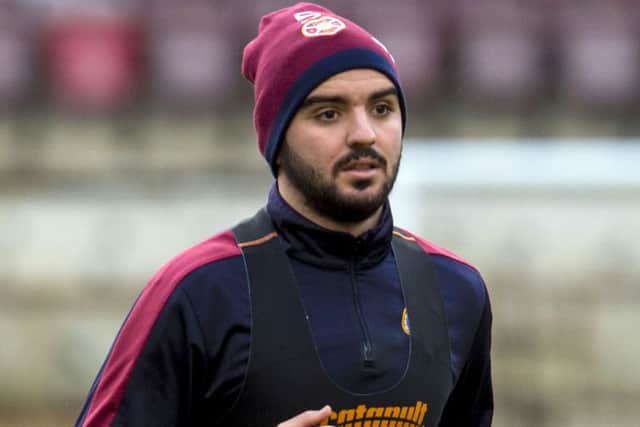 Hearts' Alim Ozturk has found himself as third choice centre back this season. Picture: SNS