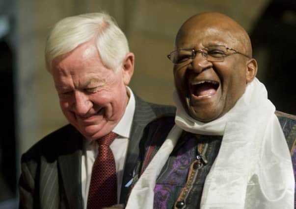 Allister Sparks shares a joke with Archbishop Emeritus Desmond Tutu. Picture: Rodger BoschAFP/Getty Images)