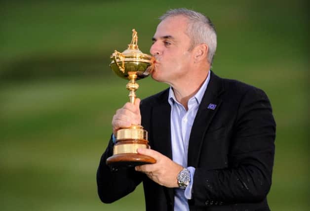 Paul McGinley plants a kiss on the trophy after overseeing Europes five-point win at Gleneagles.
 Picture: Jane Barlow