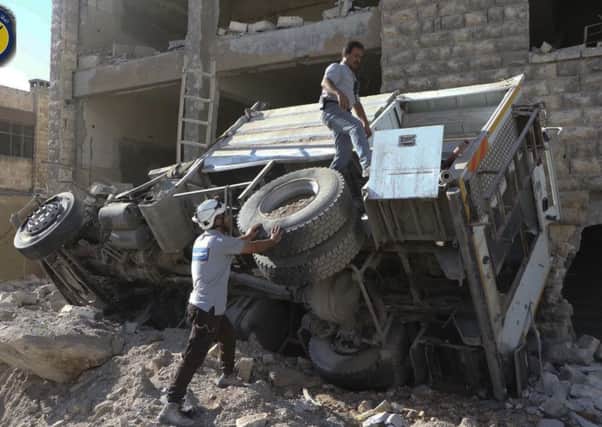 Rescue workers remove a destroyed ambulance outside the Syrian Civil Defence main centre after airstrikes in Ansari neighbourhood in the rebel-held part of eastern Aleppo, Syria.
Picture:  Syrian Civil Defence White Helmets via AP