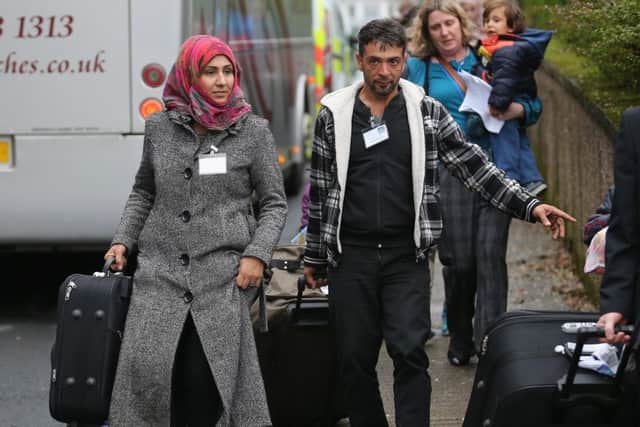 Syrian refugee families arrive on the Isle of Bute in December 2015.  (Photo by Christopher Furlong/Getty Images)
