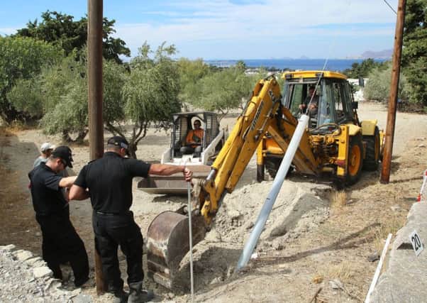 South Yorkshire Police search officers investigate an olive grove near the scene where toddler Ben Needham went missing over 20 years ago in Kos, Greece. Picture: Gareth Fuller/PA Wire