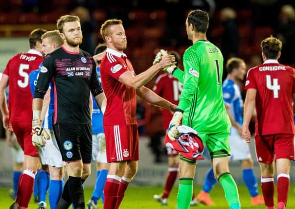 Aberdeen's Adam Rooney and Joe Lewis congratulate each other at full-time following the 1-0 quarter-final win against St Johnstone. Picture: SNS