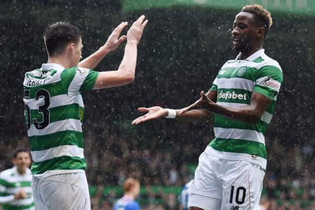 Celtic's Moussa Dembele celebrates his second goal with Kieran Tierney. Picture: SNS