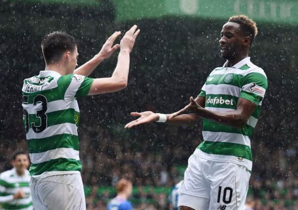 Celtic's Moussa Dembele celebrates his second goal with Kieran Tierney. Picture: SNS