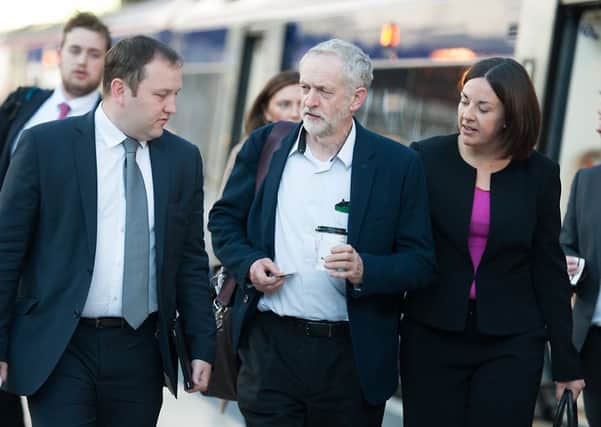 Corbyn flanked by Ian Murray and Kezia Dugdale in Glasgow. Picture: John Devlin