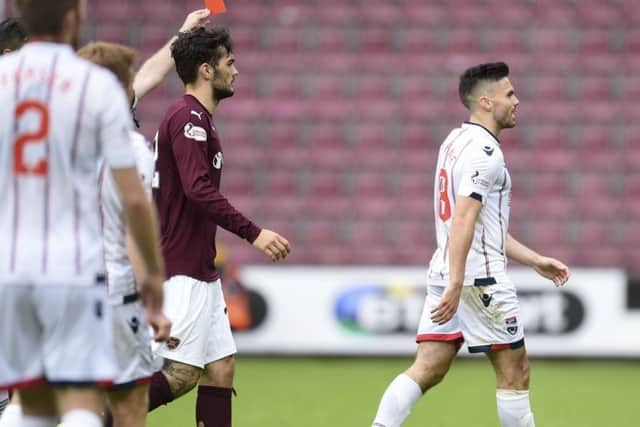 Ross County's Ian McShane is shown a red card against Hearts. Picture: SNS