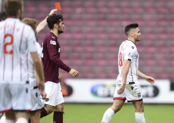 Ross County's Ian McShane is shown a red card against Hearts. Picture: SNS