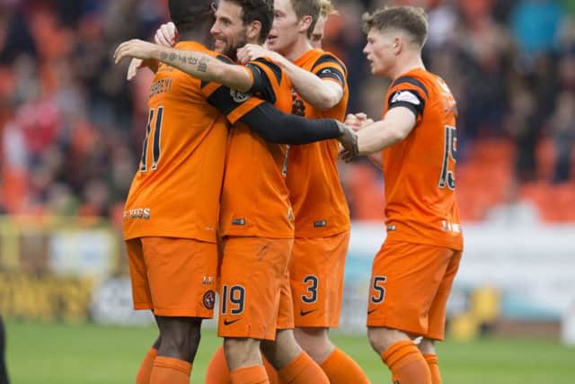 Dundee United's Tony Andreu (second left) celebrates scoring the opening goal. Picture: Kenny Smith/SNS