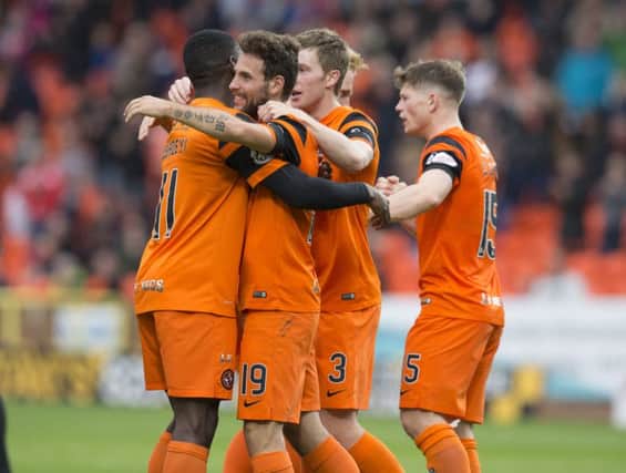 Dundee United's Tony Andreu (second left) celebrates scoring the opening goal. Picture: Kenny Smith/SNS