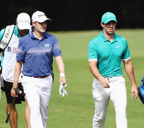 Russell Knox walks with playing partner Rory McIlroy in the third round of the Tour Championship in Atlanta. Picture: Getty Images