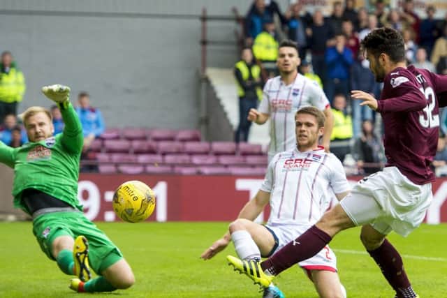Hearts' Tony Watt (right) sees his shot saved by County goalkeeper Scott Fox. Picture: SNS.