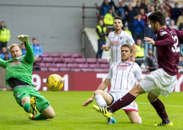 Hearts' Tony Watt (right) sees his shot saved by County goalkeeper Scott Fox. Picture: SNS.