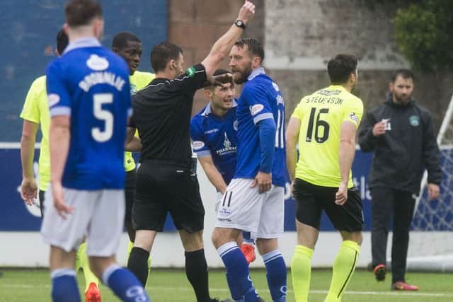 Hibernian's Lewis Stevenson, right, is sent off at Palmerston Park. Picture: SNS.