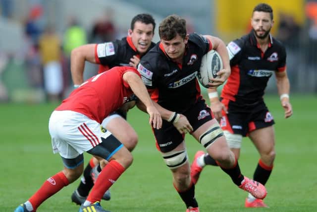 Magnus Bradbury thunders through the Munster defence, supported by John Hardie and Sean Kennedy. Picture: David Gibson.