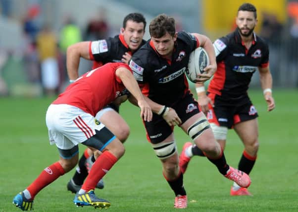 Magnus Bradbury thunders through the Munster defence, supported by John Hardie and Sean Kennedy. Picture: David Gibson.