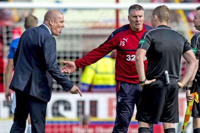 Rangers manager Mark Warburton, left, makes his feelings known to referee John Beaton. Picture: SNS.