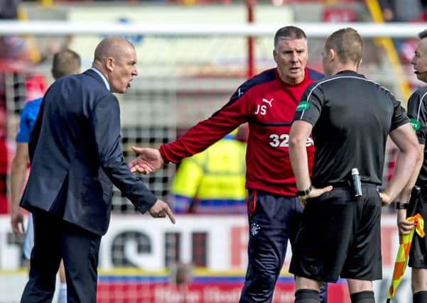 Rangers manager Mark Warburton, left, makes his feelings known to referee John Beaton. Picture: SNS.