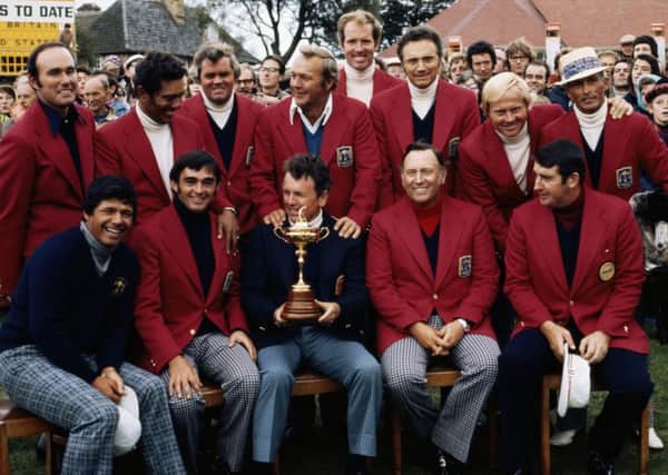 Jack Burke, Jr., captain of the United States, holding the Ryder Cup trophy, celebrates with his team members. Picture: Getty.
