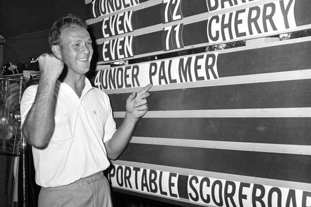 File photo shows Arnold Palmer pointing to his name on the press tent scoreboard showing his four-under-par total, for 72 holes, during the National Open golf tournament at the Cherry Hills Country Club in Denver, 1960. Picture: AP