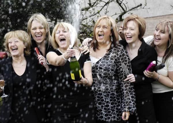 Four of the seven hair salon workers who won almost Â£3million in last Wednesday's Lotto, (left to right) Natalie McDonald, Wendy Brown, Michelle Donald and Lorna Alexander, celebrate their win at the salon in Glasgow. PRESS ASSOCIATION Photo. Picture date: Tuesday March 6, 2007. The winners work at the Smile Hair and Beauty Salon in Glasgow. See PA story SCOTLAND Lottery. Photo credit should read: Danny Lawson/PA Wire