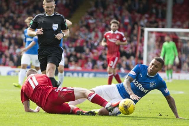 Rangers' James Tavernier (right) was adjudged to have brought down Aberdeen's Jonny Hayes. Picture: PA