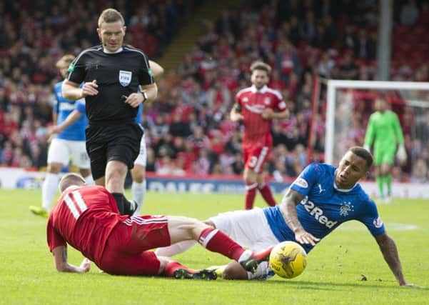 Rangers' James Tavernier (right) was adjudged to have brought down Aberdeen's Jonny Hayes. Picture: PA