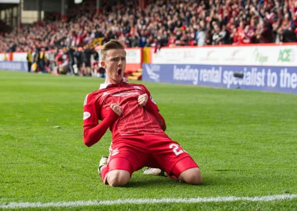 Aberdeen's James Maddison celebrates scoring the winning goal in yesterday's clash with Rangers. Picture: PA