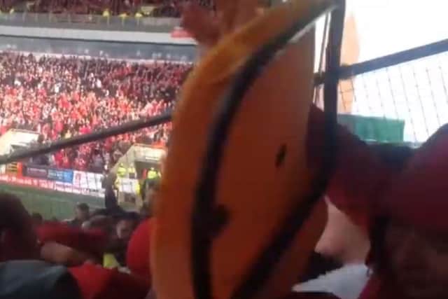 The clips shows a fan being hit by a chair