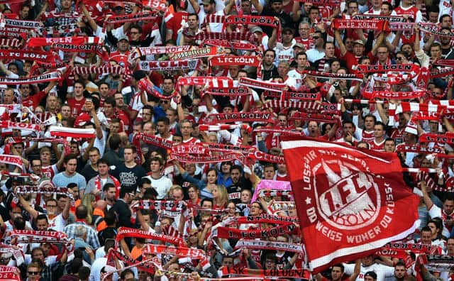 Koln fans use the tune of the popular Scottish song for their own anthem. Picture: AFP/Getty