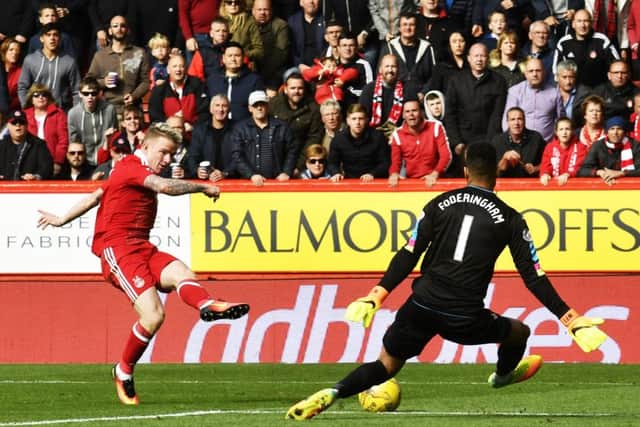 Jonny Hayes fires between the legs of Wes Foderingham to give Aberdeen the lead over Rangers. Picture: SNS