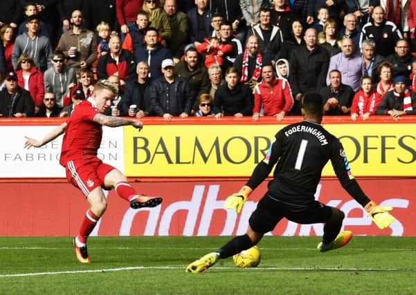 Jonny Hayes fires between the legs of Wes Foderingham to give Aberdeen the lead over Rangers. Picture: SNS