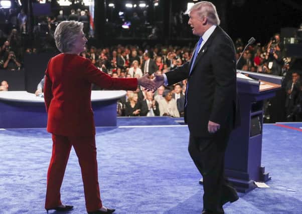 Democratic presidential nominee Hillary Clinton shakes hands with Republican presidential nominee Donald Trump after the presidential debate at Hofstra University in Hempstead. Picture: AP