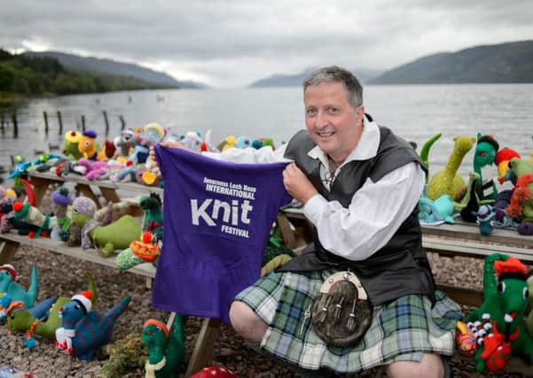 Gary Campbell, President of the Official Loch Ness Monster Fan Club, with a selection of knitted Nessies submitted from around the world. Picture: Contributed