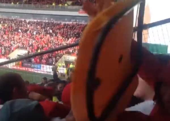 One fan was hit by a seat in a clip released online.