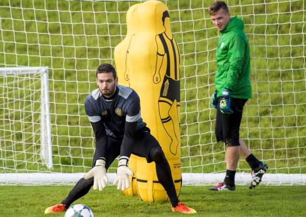 Dorus de Vries keeps an eye on Celtic's Craig Gordon in training. Picture: Craig Williamson/SNS
