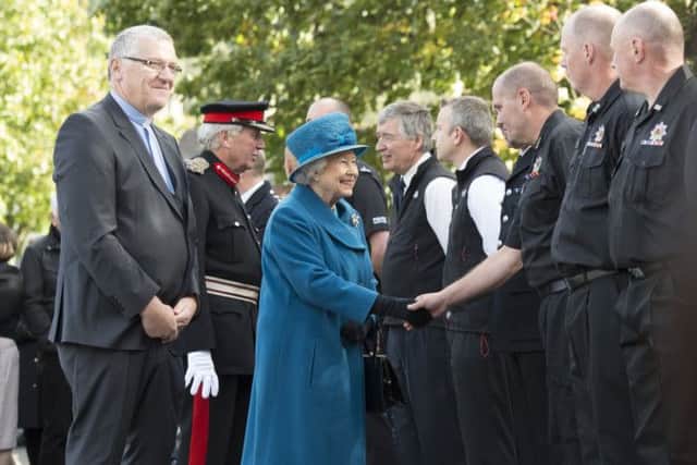 Queen Elizabeth II meets members of the local fire service during a visit to Ballater. Picture; John Linton.