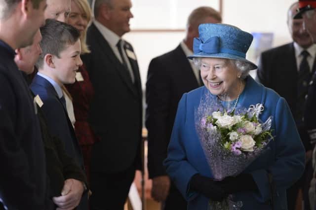 Queen Elizabeth II meets members of the recently reopened Balloter Golf Club. Picture; John Linton