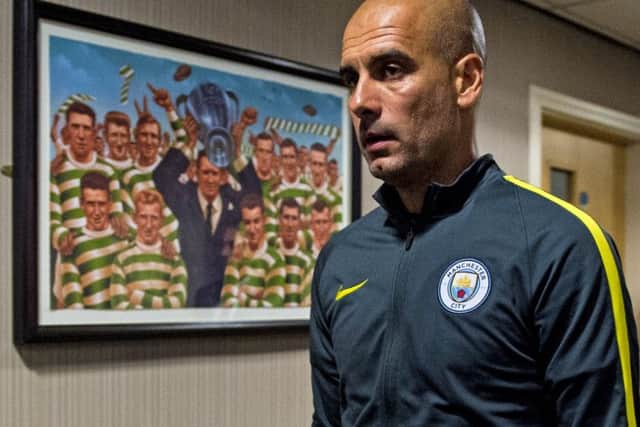 Manchester City manager Pep Guardiola enters the pre-match press conference at Celtic Park. Picture: SNS Group