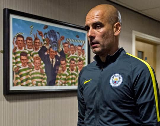 Manchester City manager Pep Guardiola enters the pre-match press conference at Celtic Park. Picture: SNS Group