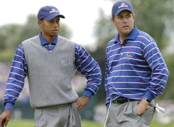 Tiger Woods and Phil Mickelson failed to spark as a pairing in Hal Sutton's USA team at the 2004 Ryder Cup at Oakland Hills. Picture: Al Messerschmidt/WireImage