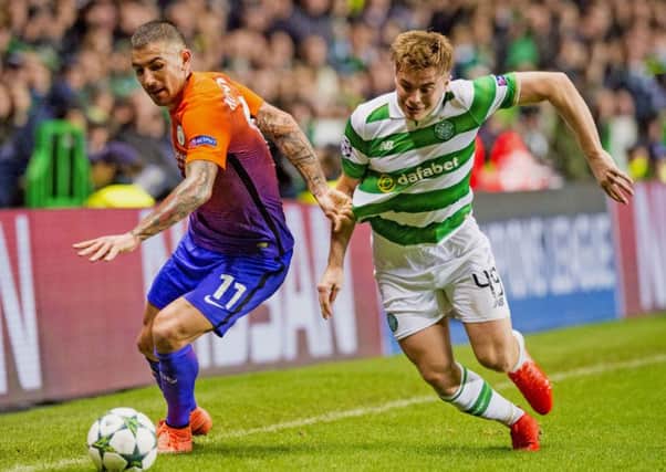 Celtic's James Forrest takes on Aleksander Kolarov during the high-octane encounter. Picture: SNS