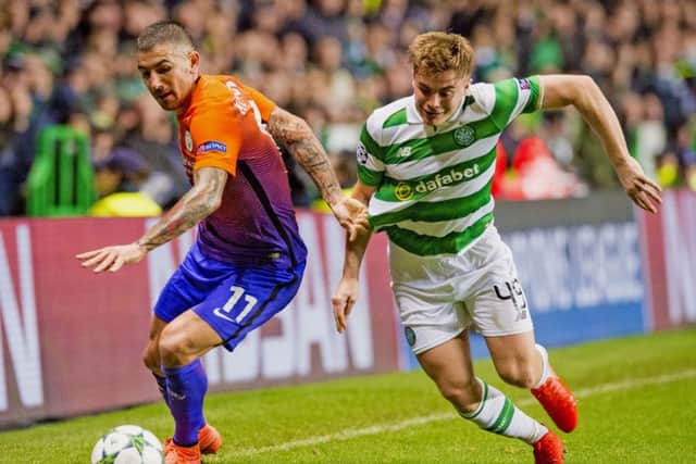 Celtic's James Forrest takes on Aleksander Kolarov during the high-octane encounter. Picture: SNS