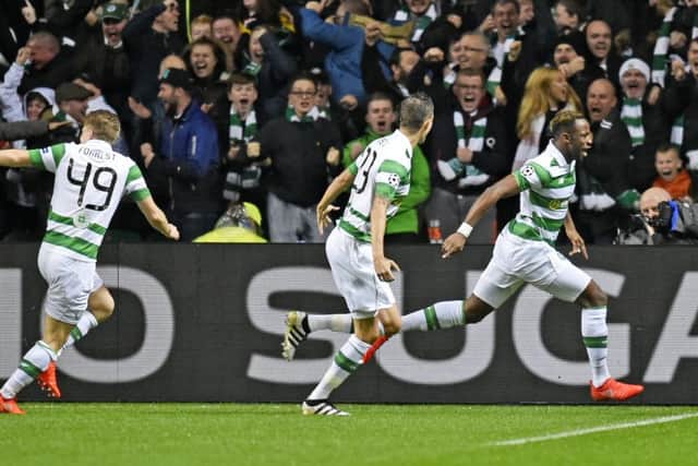 Celtic celebrate after Moussa Dembele, right, celebrates opening the scoring. Picture: SNS