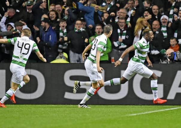 Celtic celebrate after Moussa Dembele, right, celebrates opening the scoring. Picture: SNS
