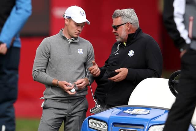 European captain Darren Clarke chats to Danny Willett about his brother's comments. Picture: Getty Images